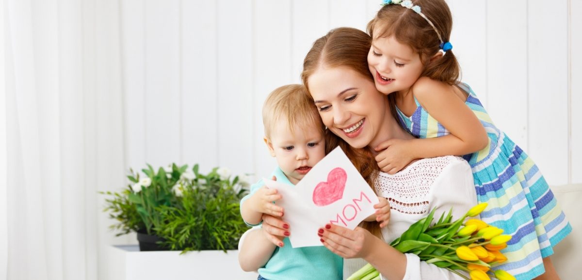 Country Harvest 6 ways to take some “Me Time” this Mother’s Day image of two young children hugging mother holding mother’s day card